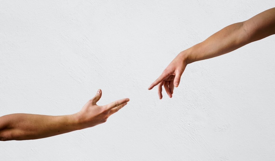 persons hand on white wall