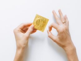 Person Holding Condom