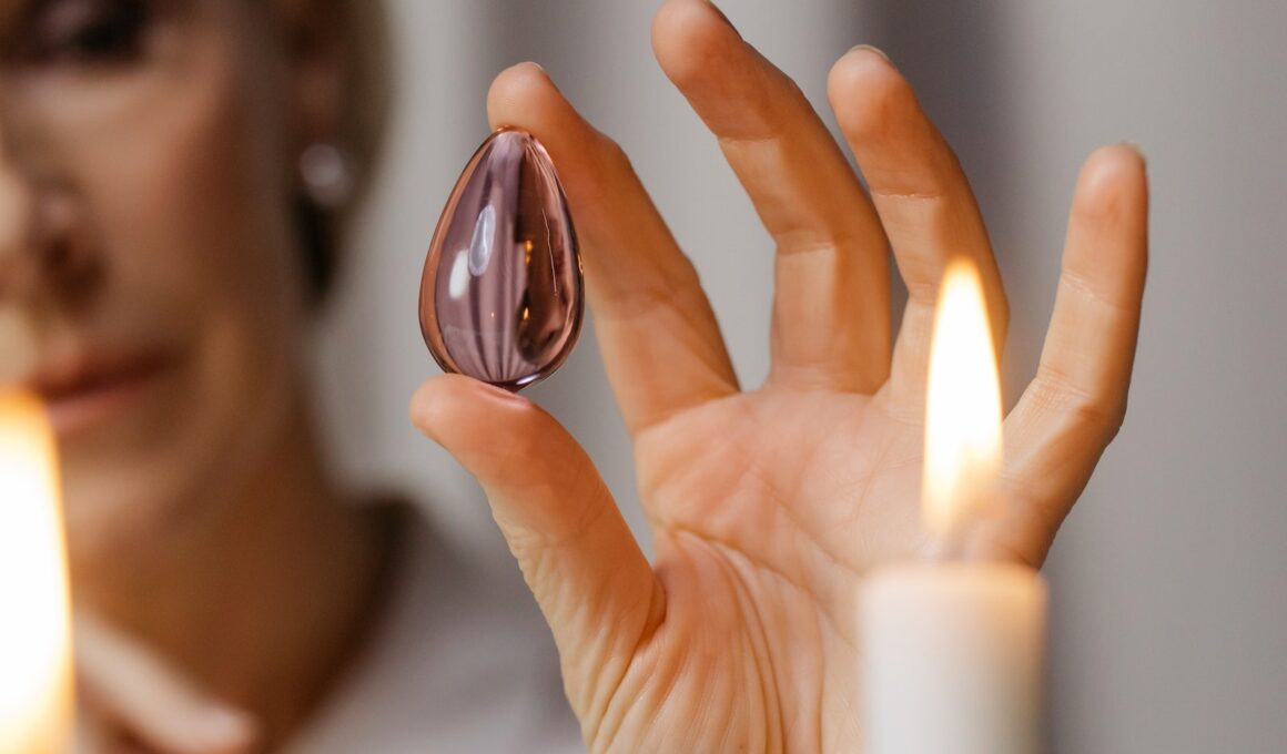 Person Holding Lighted Candle in Front of Person