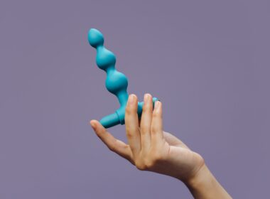 A Person Holding a Sex Toy