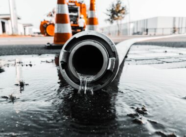 water coming out from gray pipe