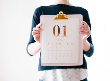 person holding calendar at January