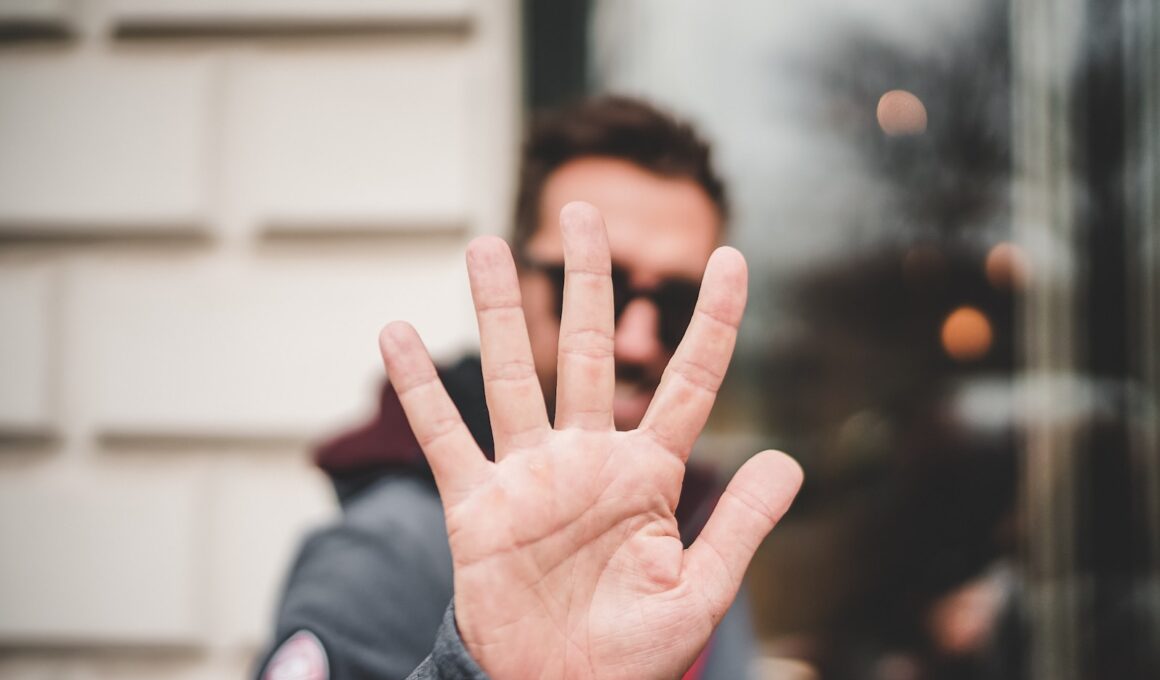 man raising right hand