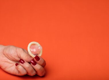 person holding white round ornament