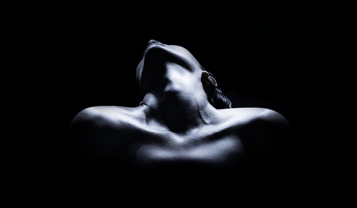 topless woman with black background