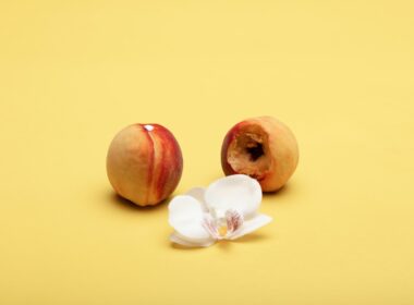 two red and white round fruits