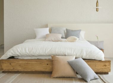 white bed pillow on brown wooden bed frame