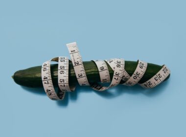 green cucumber and measuring tape