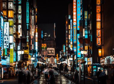 people walking on street during night time