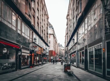 people walking on street between buildings during daytime