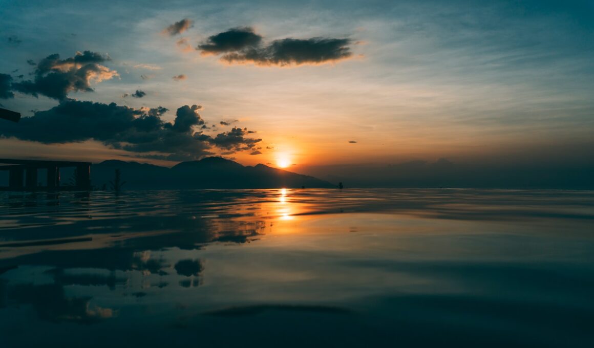 body of water during sunset