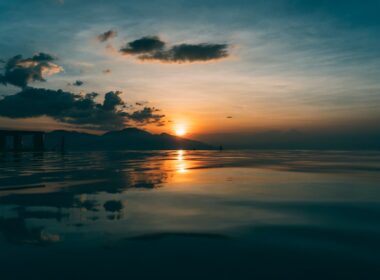 body of water during sunset