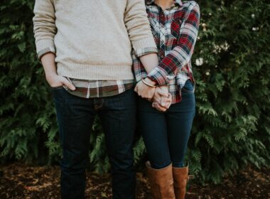 woman holding man hand